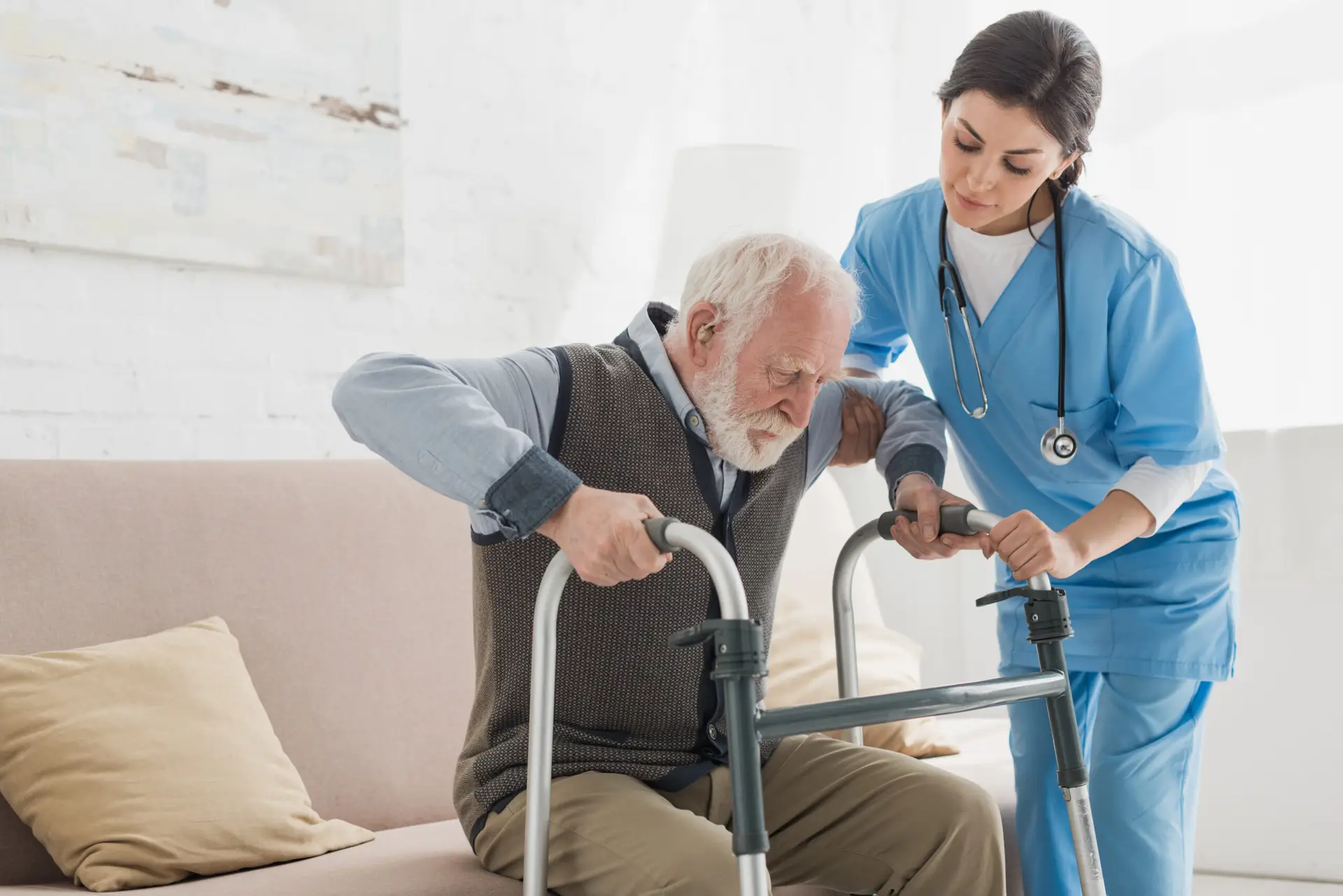Elderly man receiving in-home physical therapy to improve strength and balance.